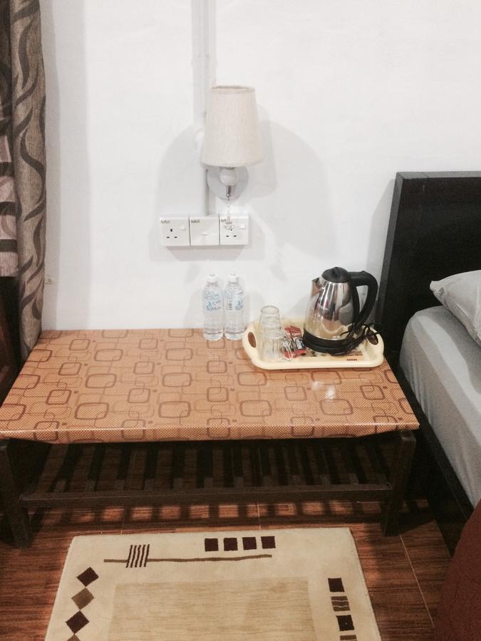 Roomstay Zulmi Arau Buitenkant foto